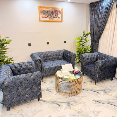 Relaxing Blue Coaches With Books And Flowers at The Decent Luxury Guest House