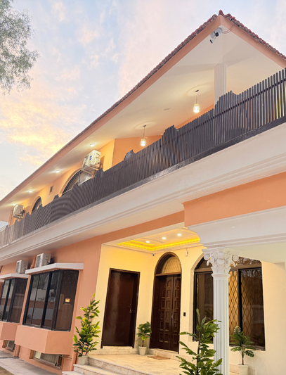 A hotel lobby with elegant decor, comfortable seating, and a reception desk At The Decent Luxury Guest House